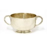 A Scottish silver bowl, by David Aitken, Glasgow, 1905,with twin handles and a hammered finish, 16cm