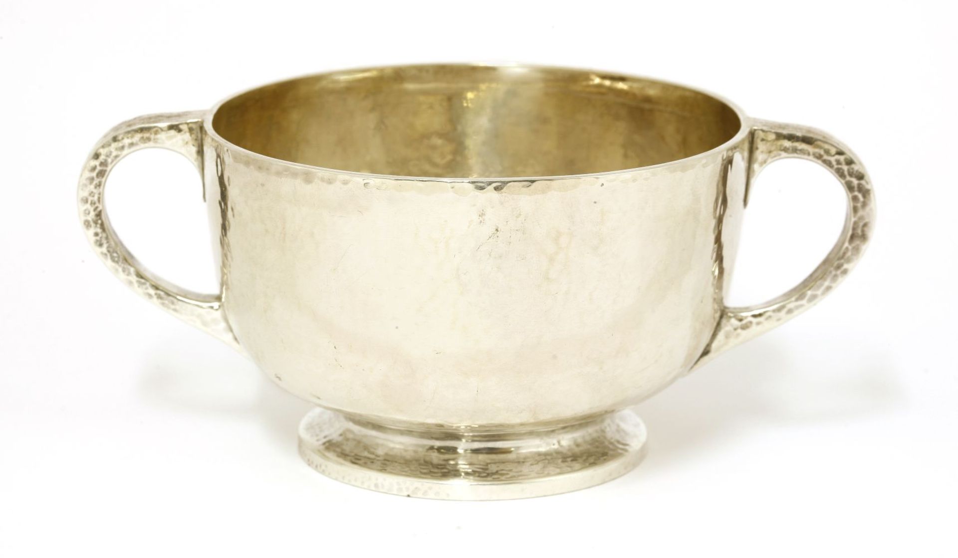 A Scottish silver bowl, by David Aitken, Glasgow, 1905,with twin handles and a hammered finish, 16cm