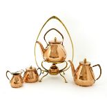 A Carl Deffner copper kettle on stand, anda three-piece tea set,with brass and wicker mounts, all