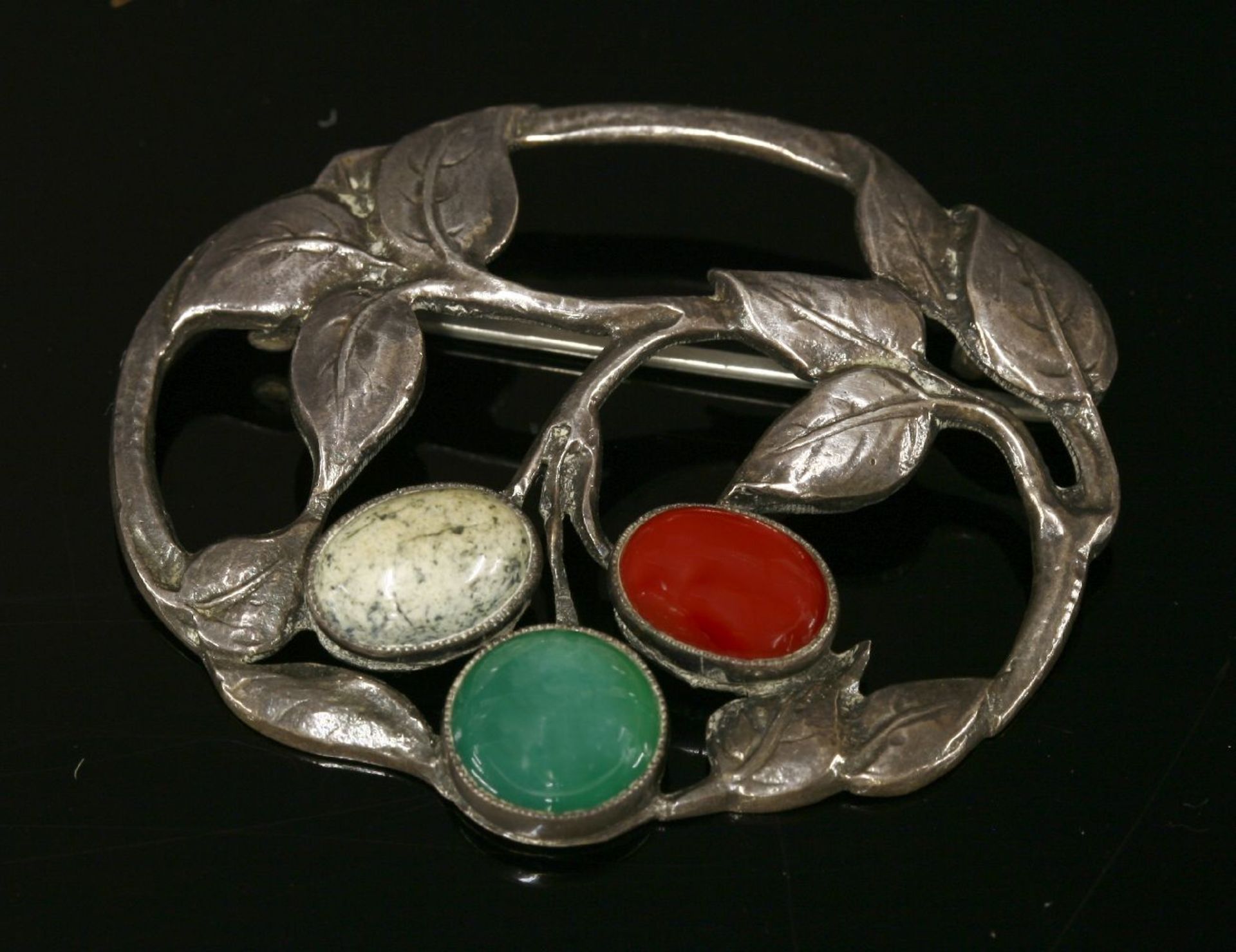 A Bernard Instone silver pierced foliate leaf brooch,of oval pierced form with a design of scrolling