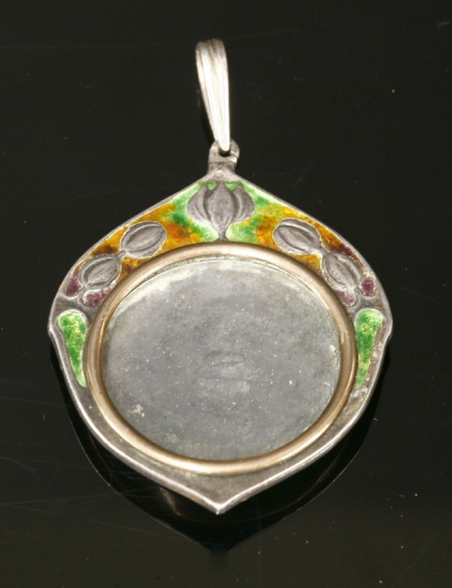 A silver and enamelled picture locket pendant by William Hair Haseler, design attributed to