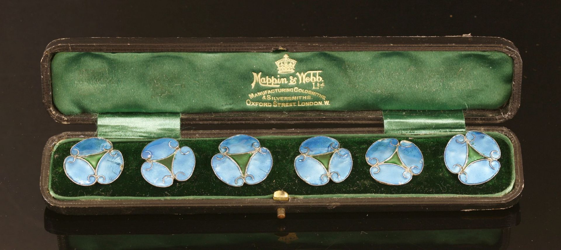 A cased set of six Art Nouveau silver enamel buttons, each button in the form of a stylised flower