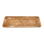 A Newlyn Arts and Crafts copper tray, of rectangular form, decorated with a continuous frieze of