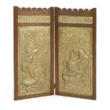 A Keswick School two-fold screen,with embossed panels depicting men struggling with a dragon and a