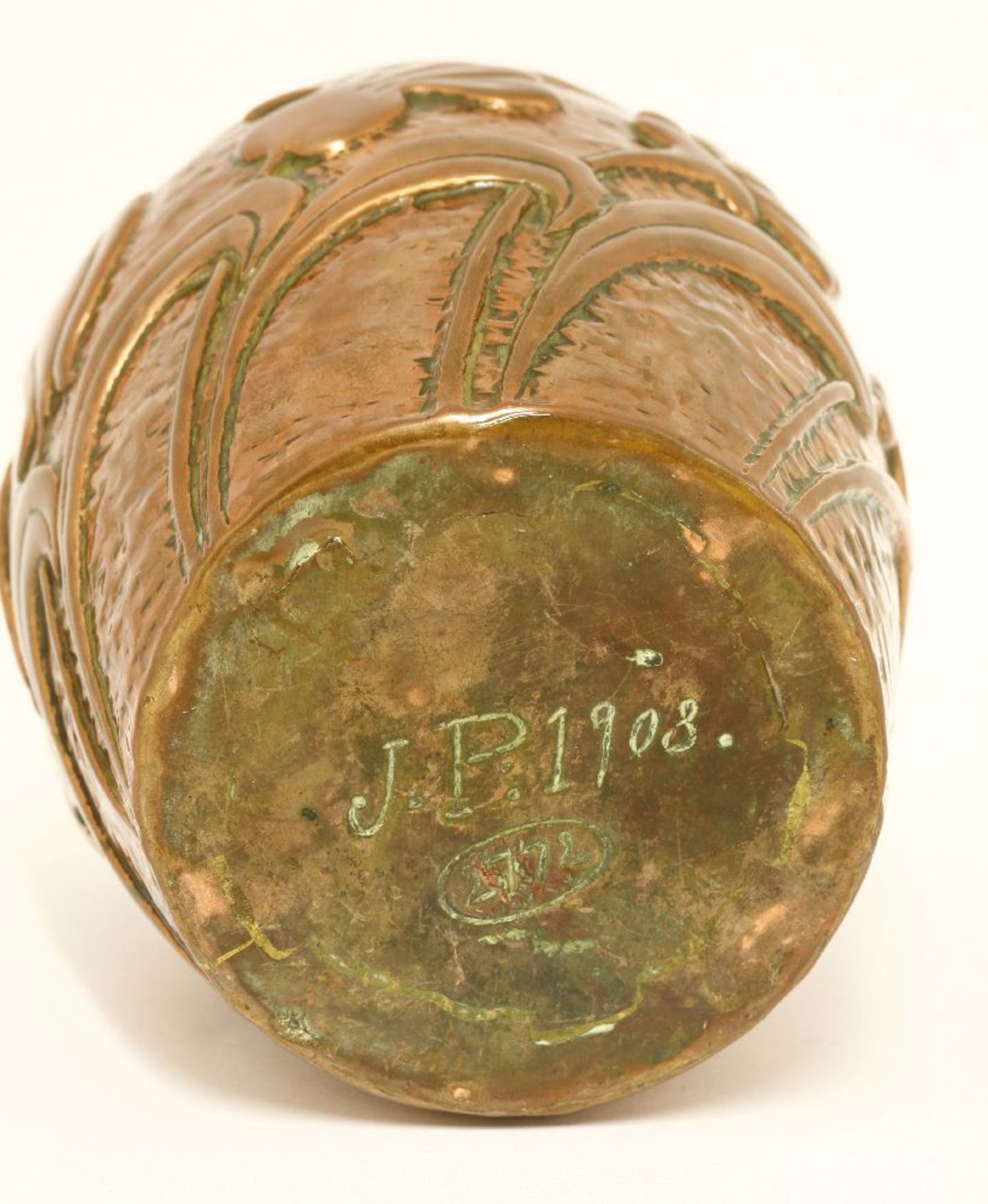 A copper vase,by John Pearson, embossed with flowers on a hammered ground, struck 'J.P. 1908' and - Image 2 of 2