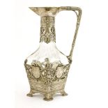 A WMF claret jug or carafe,the cut glass mallet body with pierced mounts, possibly lacking
