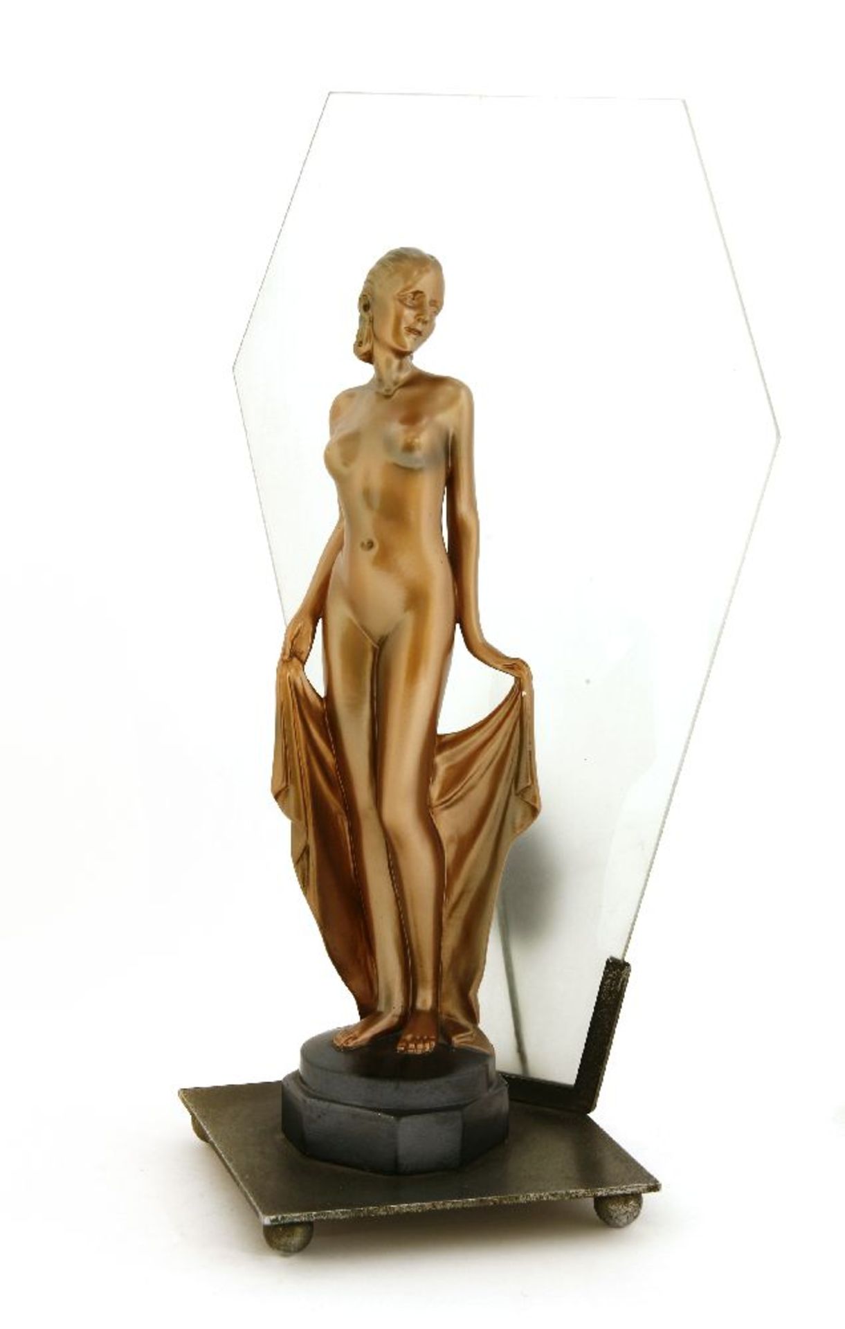 An Art Deco spelter table lamp,mounted with a nude, in a copper finish, with a lozenge glass panel,