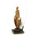 An Art Deco spelter table lamp,mounted with a nude, in a copper finish, with a lozenge glass panel,