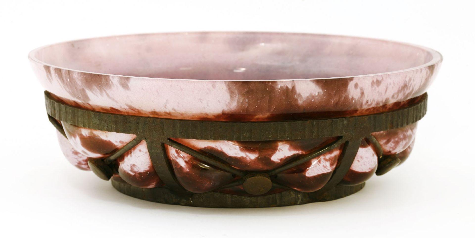 A mottled pink glass bowl,Verriere d'Art Lorraine, with a wrought iron mount after a Majorelle