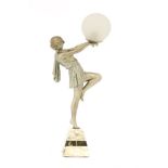 An Art Deco spelter and marble table lamp,the silvered figure holding aloft a glass globe,9cm
