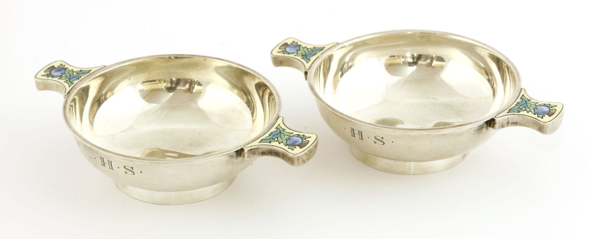 A pair of silver quaich,by Bernard Instone, Birmingham 1929,the enamelled lug handles decorated with