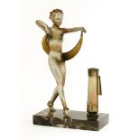 A spelter and cold painted table lighter,after Lorenzl, modelled as a dancer beside a column,