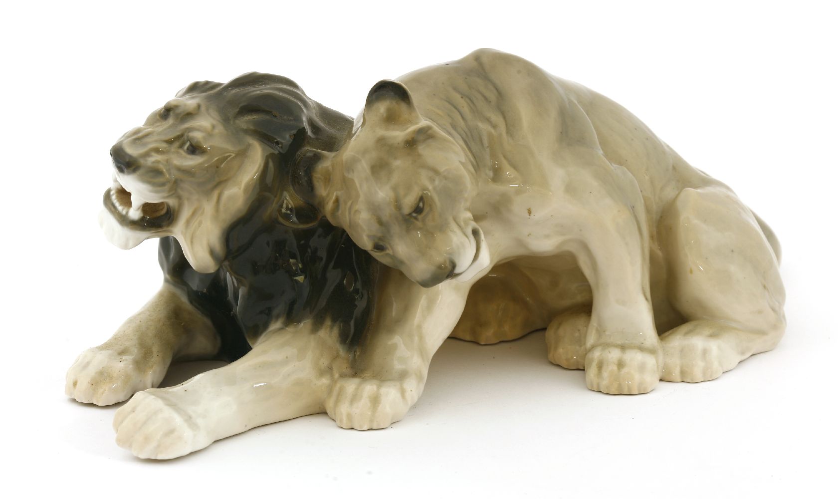 A Bing & Grøndahl group of a lion and lioness,numbered '1823', 37cm long