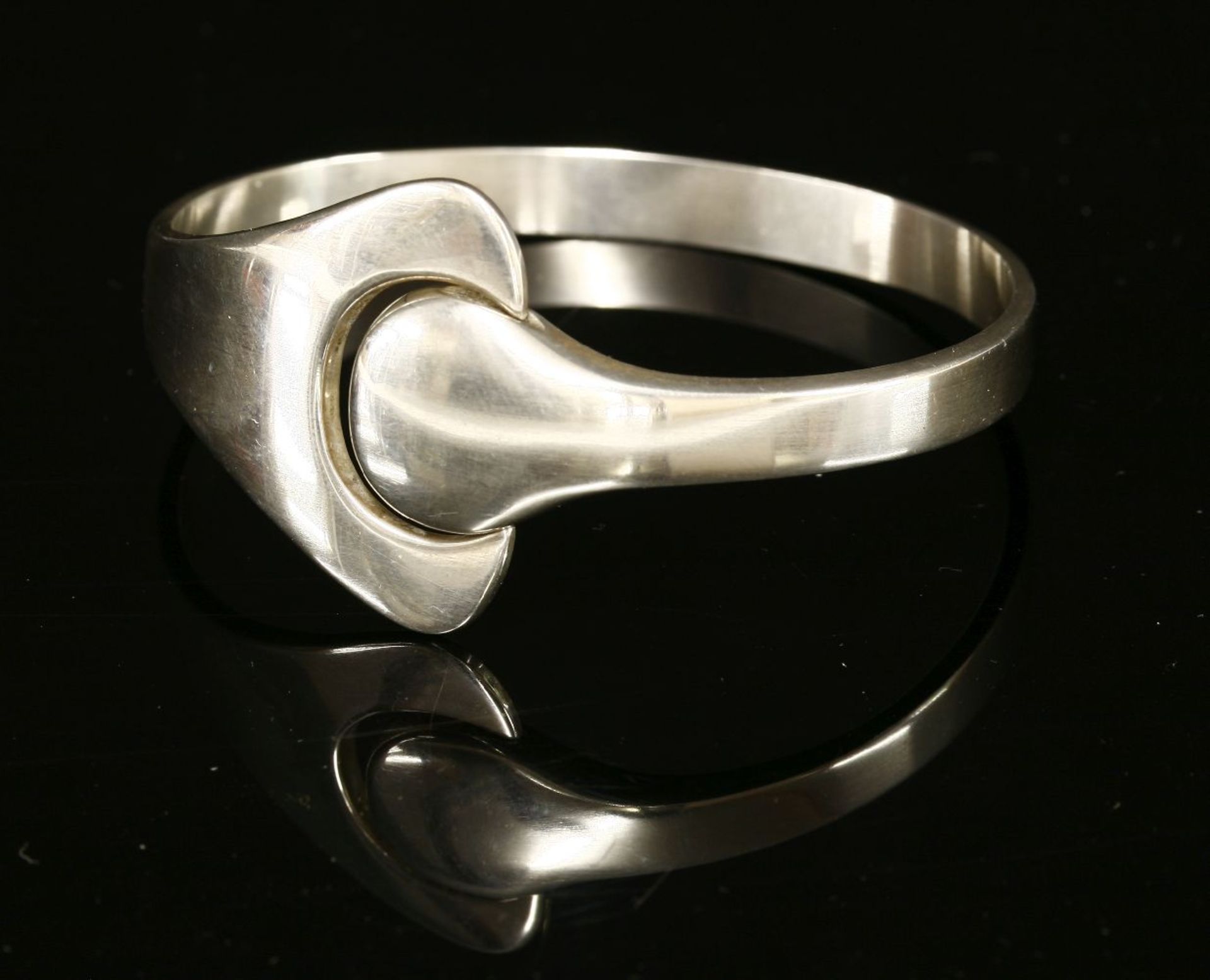 A Georg Jensen sterling silver puzzle bracelet,designed by Hans Hansen, polished silver with a '