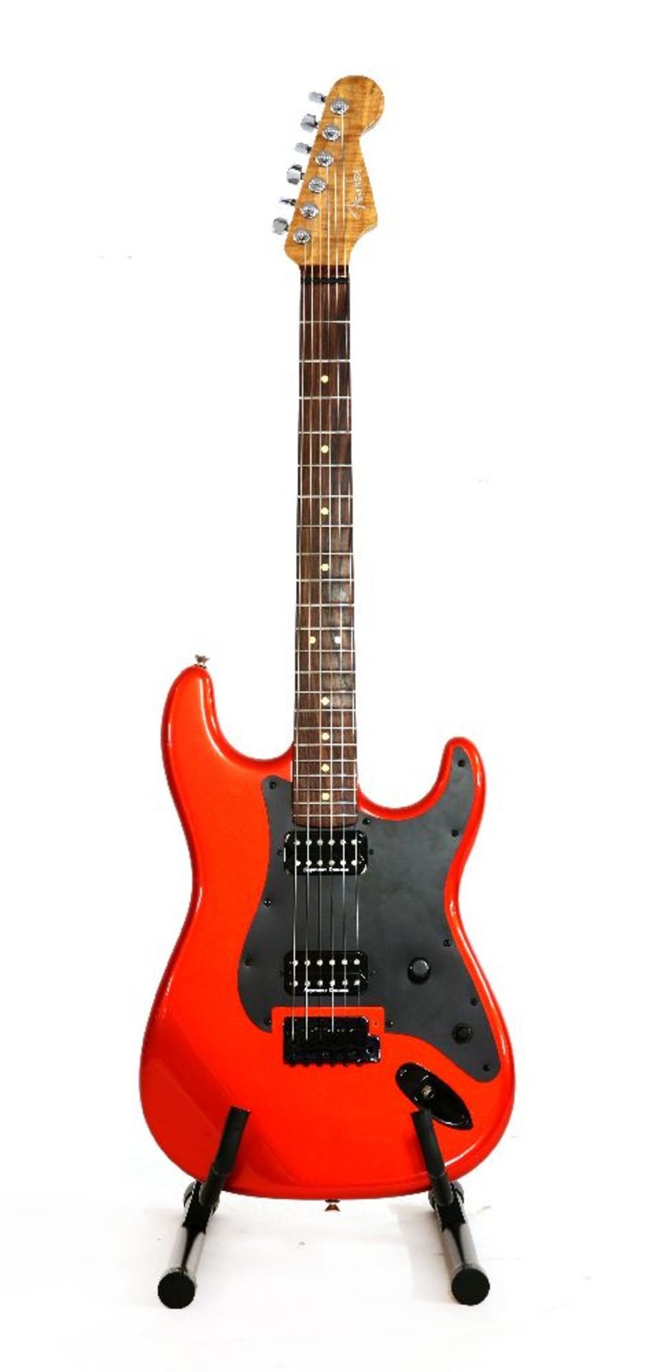 A luthier built Fender Stratocaster style electric guitar,the metallic orange body fitted with