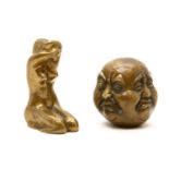 Two brass items, comprising: a Chinese four sided head, with cast seal mark, a kneeling naked lady