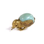 A gilt metal chick tape measure with turquoise egg. 3cm high