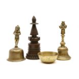 Two Indian brass bells, a pagoda and a bowl