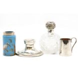 A silver topped glass scent bottle, a blue glass vase with silver rim, an inkwell and an Asprey