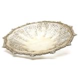 A Continental silver shallow bowl, with alternating pierced leaf decorated panels within a shell and