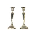 A pair of filled silver candlesticks of tapering angular form, by James Dixon & Sons Ltd, Sheffield,