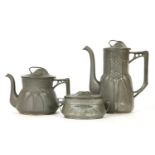 A secessionist pewter three piece tea set, stamped mark and numbered, one handle detached