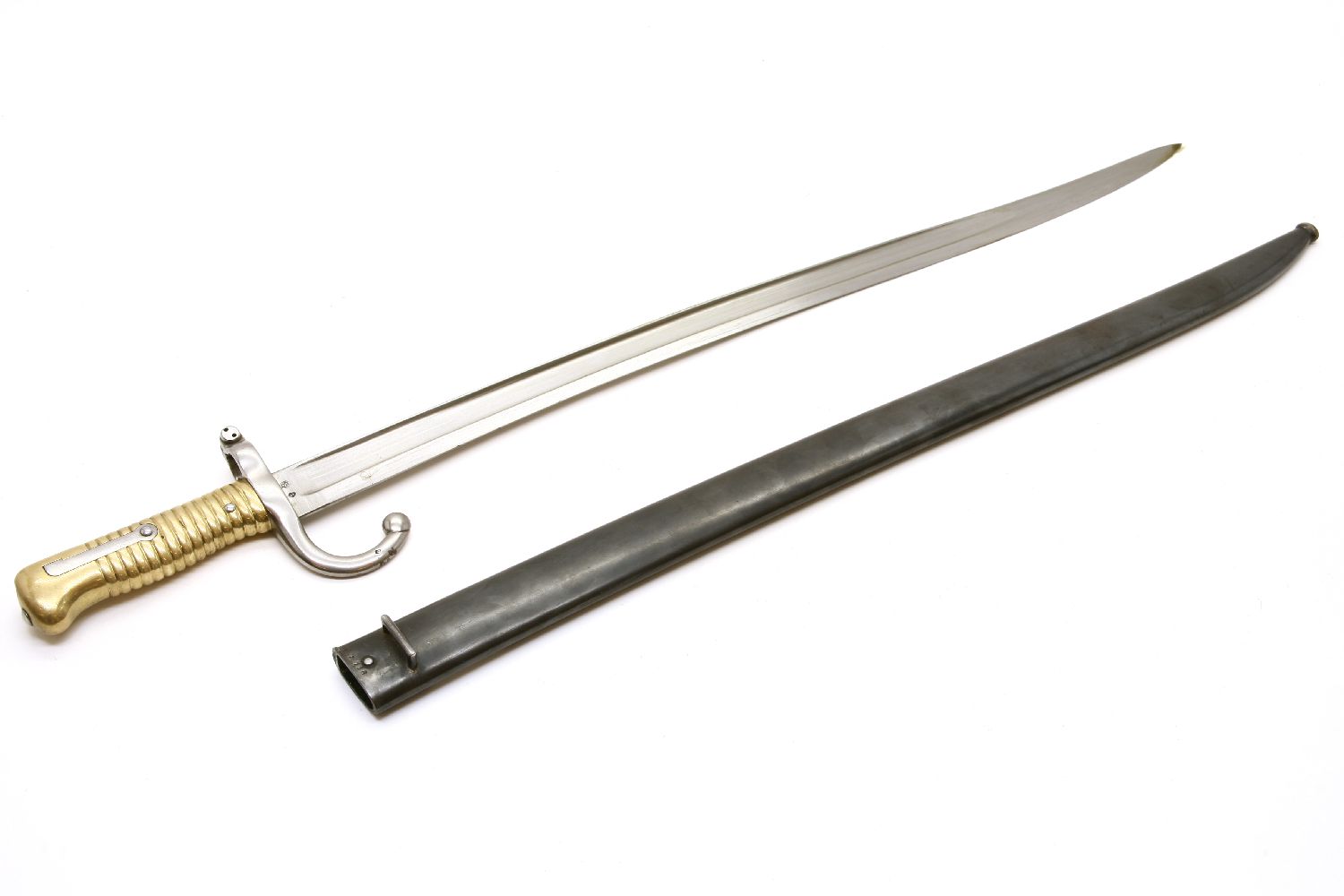 A French Chassepot bayonet and scabbard, inscribed ' Mre D'Armes de Chat Janvier 1872. 71cm long