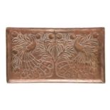 A Keswick style Arts and Crafts copper tray, decorated in relief with peacocks and a fruiting tree