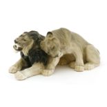 A Bing & Grøndahl group of a lion and lioness,numbered '1823', 37cm long