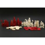 A collection of ivory Chinese export chess pieces, an incomplete set, twelve natural, twelve