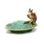 A late 19th century Minton majolica nut dish, with squirrel perched on the edge of a leaf, date