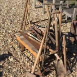 A collection of garden tools, and a cast iron trolley