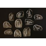 Eleven Intaglio glass weights