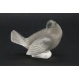 A Rene Lalique Moineau Moquer paperweight, etched signature.