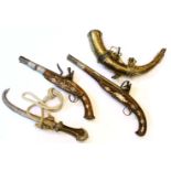 Two reproduction flintlock pistols, together with an Eastern hunting horn, and an Eastern white