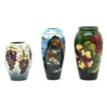 A Moorcroft trainee grapevine vase, 13.5cm high, a trial Sea cliff vase, 18cm high, and a Hibiscus