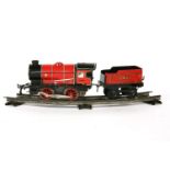 Hornby 'O' Gauge, a 3435 clock work loco, tender, and two wagons, a level-crossing, a station '