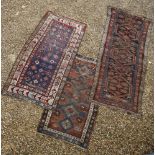 Three rugs, a Kazak, a Kurdish and another, 290cm x 118cm (3)