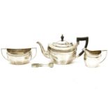A hallmarked silver three piece tea service, comprising of a teapot, a sucrier and a cream jug of