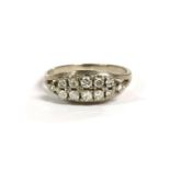 A white gold two row diamond boat shaped ring, with split shoulders, marked 585, 3.97g