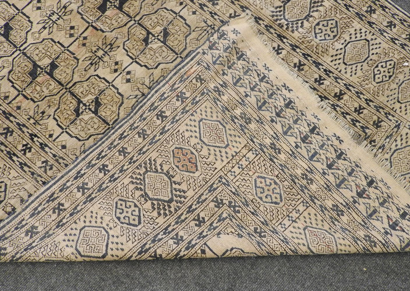 An Eastern rug, with geometric motifs on a pale brown field, 230 x 142cm - Image 2 of 2