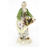 A Meissen Cris de Paris series porcelain figure, modelled after Peter Reinicke, The Hurdy Gurdy