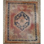 A Turkish red rug, 300cm x 450cm