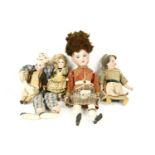 Four small bisque head dolls, including: a boy and a girl, by SFBJ, 16cm high; a boy in Scottish