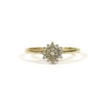 A 9ct gold diamond cluster ring, to knife shoulders and plain polished shank, 1.72g