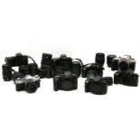 A collection of eight Canon cameras and lenses to include Canon EF 28-80mm, EF,35-70mm, Zigma