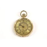 A Swiss gold open faced fob watch, marked K18, white enamel dial, blue Roman numerals (hands loose),