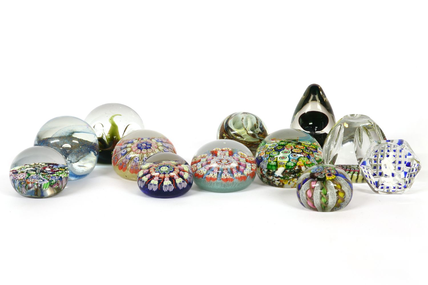 A collection of glass paperweights, to include a Whitefriars millefiori example with signature
