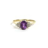 A 9ct gold oval cut amethyst and diamond cluster ring, size T½, 2.52g