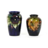 A Moorcroft Leaf and Berry vase, of shouldered form, height 11cm, together with another example,